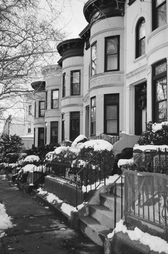 Snowy view of modern Brooklyn apartments near bed stuy